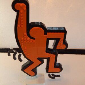 Keith Haring Lego Classic Dancing Figure in Orange.